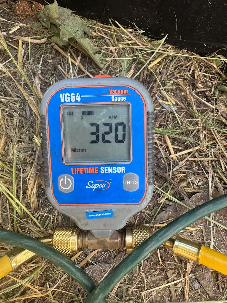 Vacuum gauge reading 320 microns on a completed system evacuation
